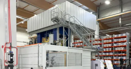 Large deep drawing press with access stairs in the production hall at Meconet’s Äänekoski plant.